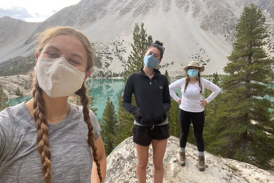 Sophomore Eliza Tiles and seniors Norah Adler and Sophia Stevens socially distance backpack in the John Muir Wilderness in California. Tiles says backpacking is a great way to enjoy the beauty of the outdoors, but she urges hikers to follow Leave No Trace principles.