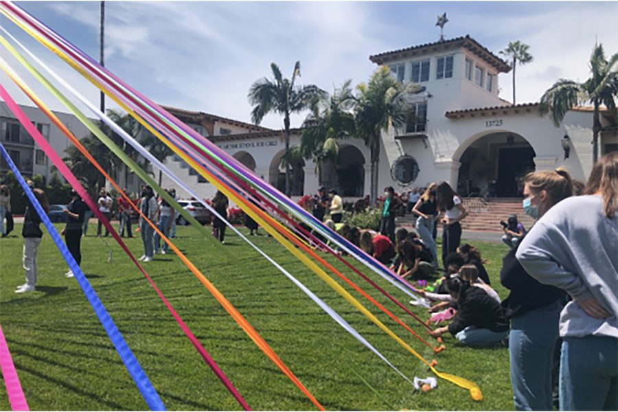 Seniors gather on the front field of Archer to put up the annual Maypole. Senior Rio Hundley described the event as refreshing. We finally got to participate in a tradition and really bond as a class in person, Hundley said.