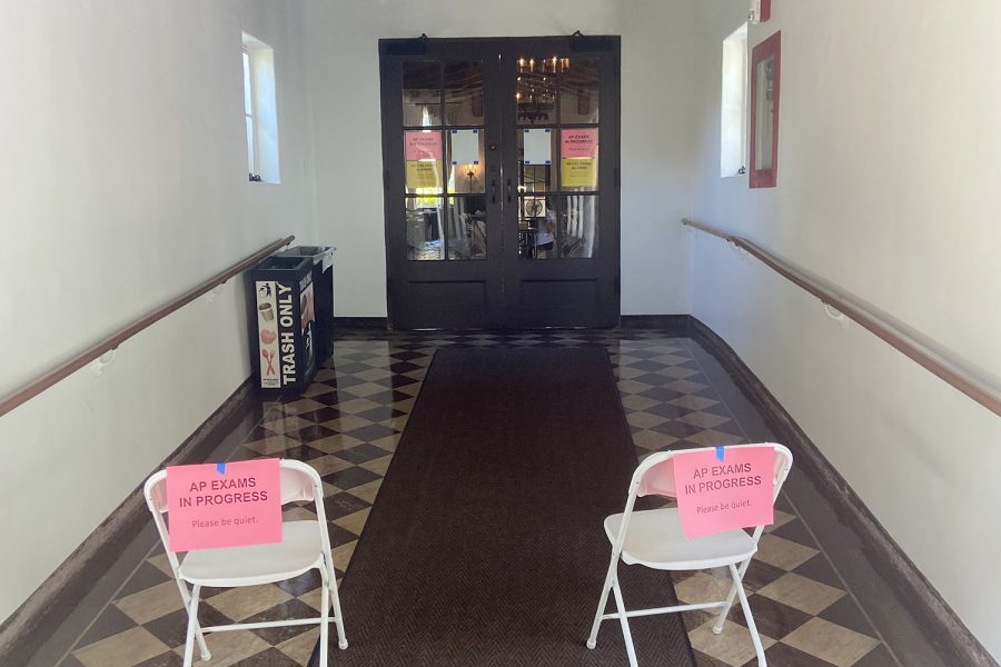 Chairs placed outside of the Dining Hall with signs to notify others to be quiet while AP Exams take place. The first AP Exams took place at Archer this week, and the rest will follow with some subjects in-person and others online.