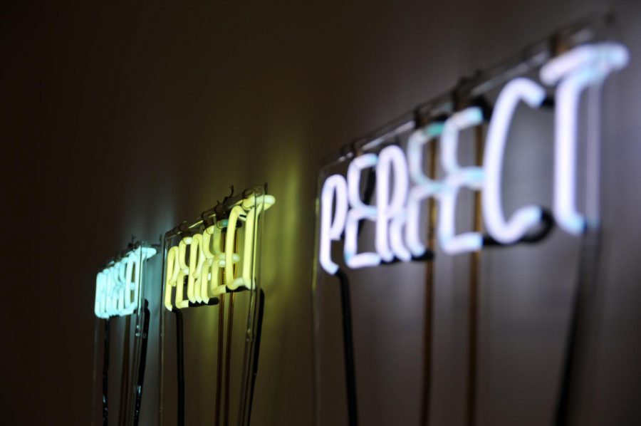Three+neon+signs+illuminate+the+word+Perfect+in+colors+turquoise%2C+yellow+and+white+in+the+Museum+of+Modern+Art+in+New+York.+My+love-hate+relationship+with+perfectionism+has+taken+on+a+new+meaning+as+I+continue+to+evolve+and+grow+older.+