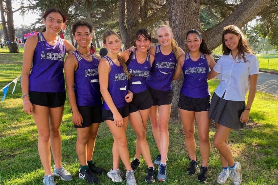 Members+of+the+varsity+cross+country+team+celebrate+after+placing+second+in+their+first+Liberty+League+meet+of+the+season.+They+trained+throughout+the+weeks+prior+to+prepare+for+the+meet.+Pictured+from+left+to+right+are+Maya+Acutt+%2825%29%2C+Kayla+Bruce+%2824%29%2C+Kate+Hanney+%2825%29%2C+Gabriella+Specchierla+%2825%29%2C+captain+Lauren+Robson+%2822%29%2C+Ali+Aragon+%2822%29+and+Keera+Levell-Guerrero+%2823%29.