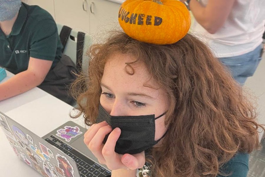 Liora Ginzburg from Salphie Sekayan’s mentorship group sits with a pumpkin on her head after being “pumpkin’d as part of a game being played by the sophomore class. During the final week of October, the sophomore class played a game of Hot Pumpkin, a take on the game Assassin. This game was one of the many Halloween festivities taking place on Archers campus.