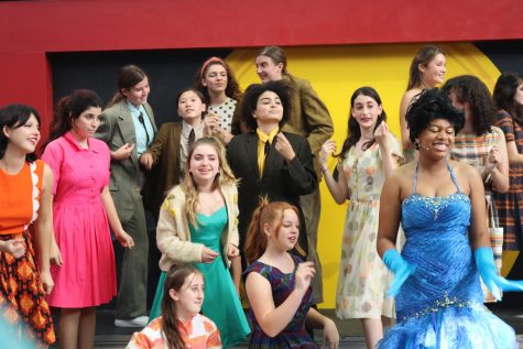 The cast of the upper school musical Leader of the Pack performs two songs from their repertoire in front of students and faculty in the amphitheater. Since being online last year, this was the first musical to go into production in front of a live audience rather than on Zoom. This allowed students to get “back in the groove of things,” according to sophomore cast member Anaiya Asomugha.