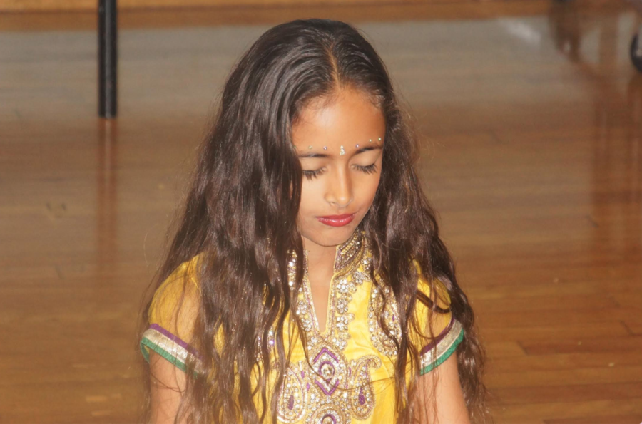 Uma Bajaj, age 10, gets ready to perform for her fifth grade elementary class in celebration of Diwali [2015]. Uma Bajaj said, “Diwali is always such a special moment that allows me to connect with my family.