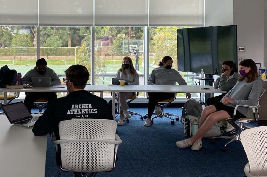 Athlete Leadership Council members sit at a table in the Lantern Room during their meeting. The ALC meets every Tuesday at lunch to discuss and coordinate their responsibilities. 