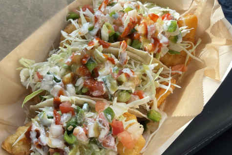 The bottom two delicacies are shrimp tacos and the top is an order of Rickys Special: a mix of shrimp and fish. Topped with slaw, chopped vegetables and crema, the tacos are beautifully crafted and absolutely delicious.
