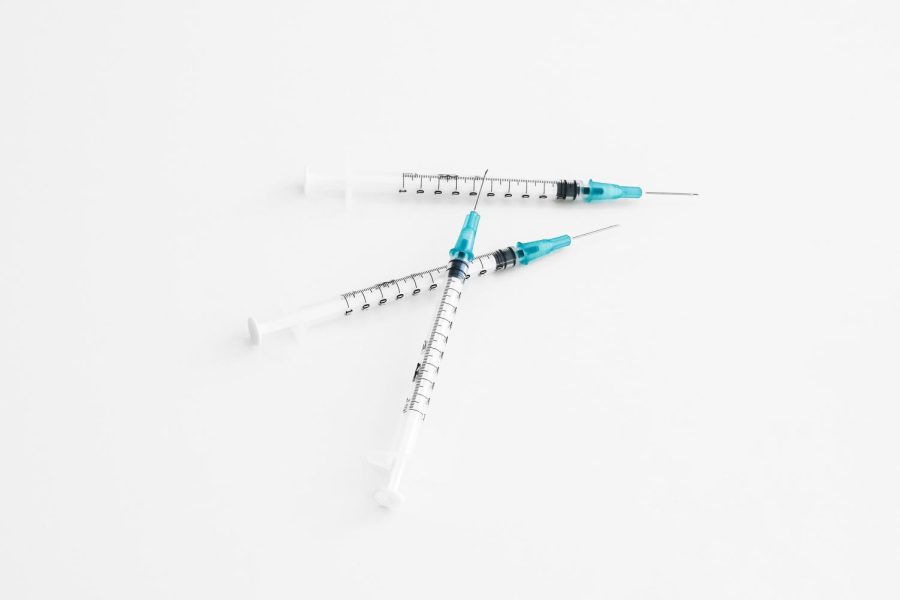 Three+syringes+are+stacked+on+top+of+one+another.+The+Archer+community+reflects+on+their+opinions+about+the+booster+and+how+new+protocols+will+impact+campus+life.+Its+really+a+multi-layered+approach+to+keeping+our+community+safe%2C+Science+Teacher+Huff+said.