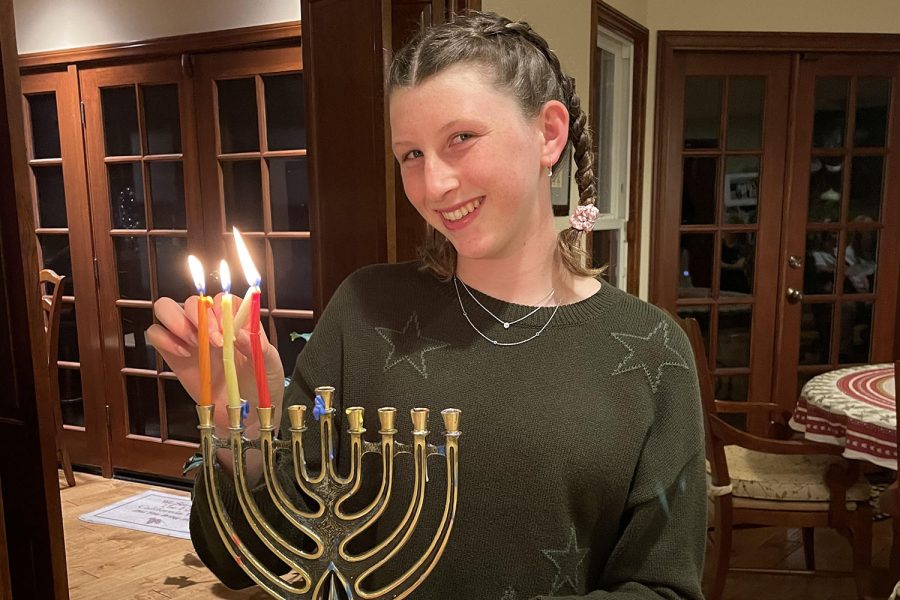 Parker Keston lights the menorah as she celebrates Chanukah with her family. Keston shared how lighting the menorah is an important aspect of the holiday.