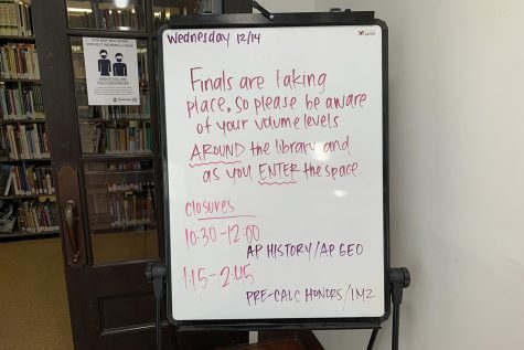A board displayed outside the library on Wednesday, Dec. 15, the first day of finals. Since middle school students still follow the regular schedule, the board reminds them to please be quiet around campus. The first day of upper school exams is on Dec. 15 and continues through the rest of the week.