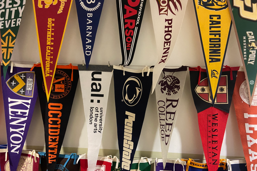 College+banners+hang+on+the+wall+of+Archer%E2%80%99s+admissions+hallway+and+represent+the+various+institutions+Archer+alumni+have+attended.+Juniors+are+working+with+college+guidance+counselors+to+begin+the+process+by+attending+informational+presentations+and+scheduling+one-on-one+meetings+with+their+counselors.%C2%A0