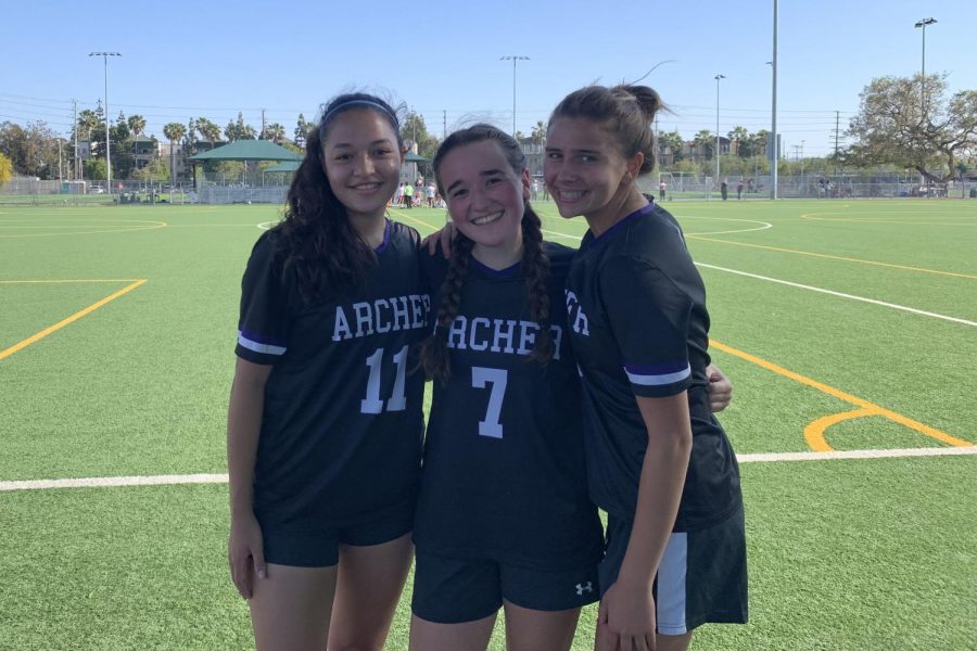 Varsity soccer captains Alessandra Aragon, Isabella Specchierla and Gabrielle Wolf pose for a picture before a game in 2020. All three of them began their Archer soccer journey in middle school, but in freshman year, they joined varsity soccer.
