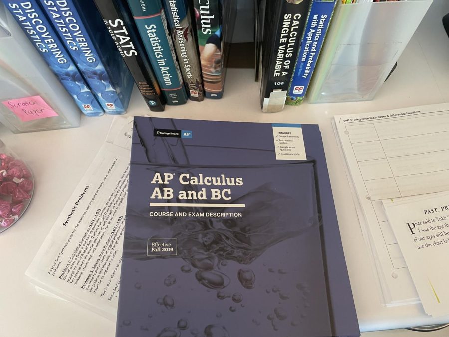 An AP Calculus AB and BC course and exam description binder sits on the desk of math teacher Monica Barragán. The binder details the specific standards and way in which to teach the AP course. Phasing out AP classes will allow teachers to choose their curriculums and teaching pace.