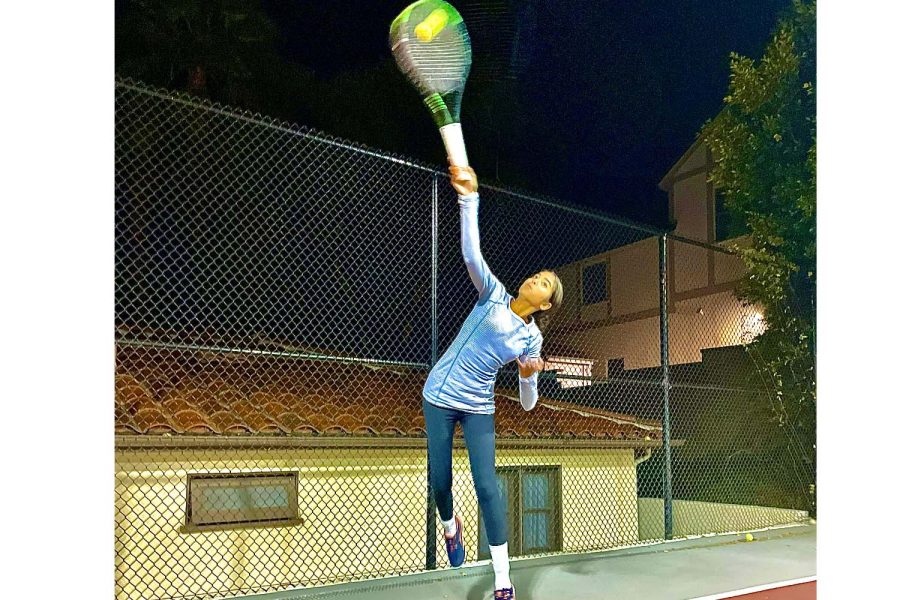 This picture shows me serving at 9 p.m. on a Tuesday night. I try to come out and take a basket of serves daily, in order to better my serve speed, technique and spin.