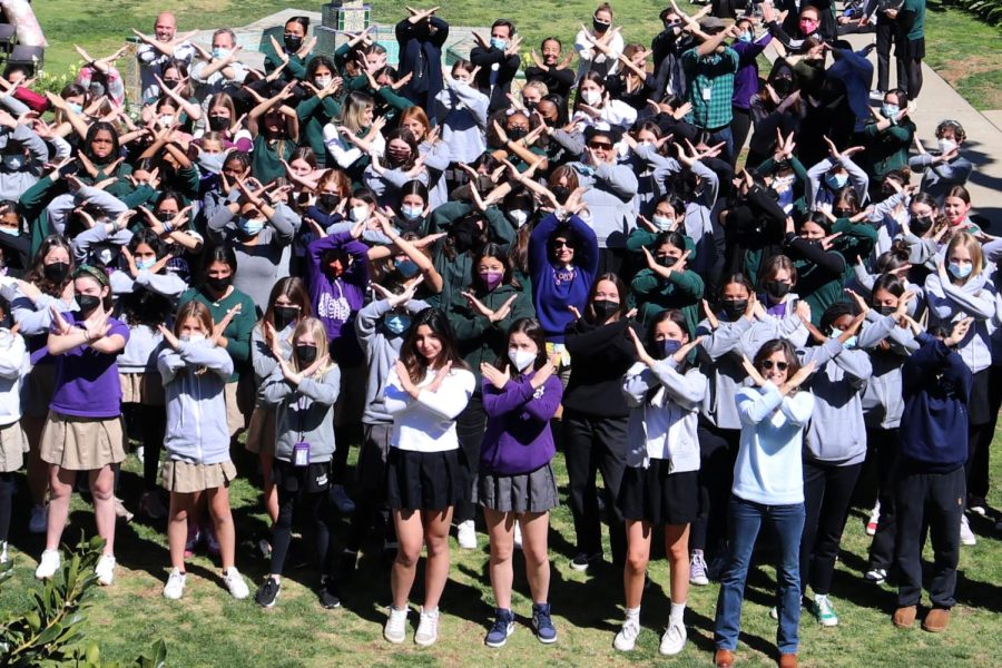 Archer students and faculty pose, making Xs with their arms for International Womens Day theme: Break the Bias. The day took place Monday, March 8, 2022, in the first full week of Womens History Month.