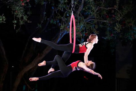 Eighth grade aerialists Josie White (26) and Sylvie Haacker (26) spin as part of their aerial dance. Four eighth grade aerialists perform Titanium during the show.