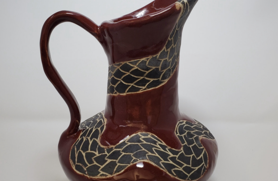 Freshman Alina Williams greek amphora pottery piece is placed for a submission photo. The piece won a blank award for the Scholastic Art and Writing Awards. The piece was a project for her Introduction to Ceramics class that her teacher Olivia Moon urged her to submit for judging.