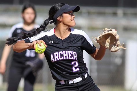 Faith Soriano prepares to throw the ball to a teammate. "Softball has been my rock," Soriano said. (Photo credit: Photo credit: Jevone Moore)