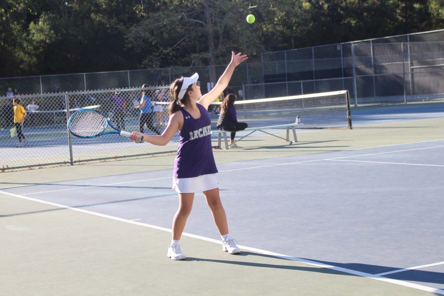 Purple+team+player+Phoebe+Miro+%2828%29+throws+the+ball+into+the+air+to+prepare+for+her+next+serve+at+the+teams+first+match+where+they+won+4-2+against+Geffen.+The+middle+school+tennis+team+consists+of+new+players+and+spirits+that+will+foster+friendships+and+improve+the+teams+playing+and+community.+Its+not+necessarily+about+winning%2C+green+team+player+Abby+Berman+said.+Its+just+really+fun+to+be+able+to+play+with+my+friends.