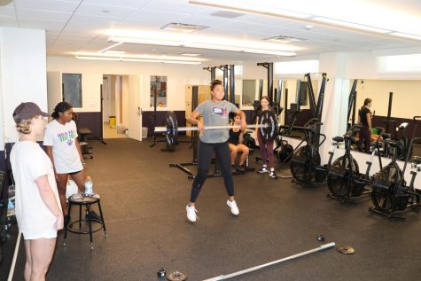 Junior Malia Apor lifts the bar and two additional ten pound weights during A-train Sept. 22. A-train takes place from 4:15 p.m. to 5:00 p.m. on Tuesdays and Thursdays.