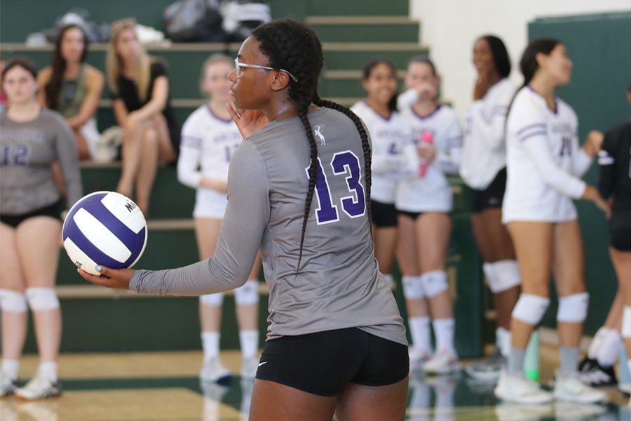 Serenity Jones (26) preparing to serve to begin the next set during their game against Buckley Sept. 24. The JV varsity volleyball teams overall record so far this season is 7-6.