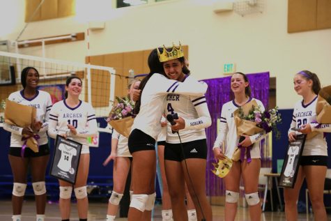 Sophomore Dylan Evans-Robinson hugs senior Uma Bajaj after giving her a speech during the varsity volleyball senior night celebration. The celebration occurred 10/13 following a home game against Pacifica Christian School.