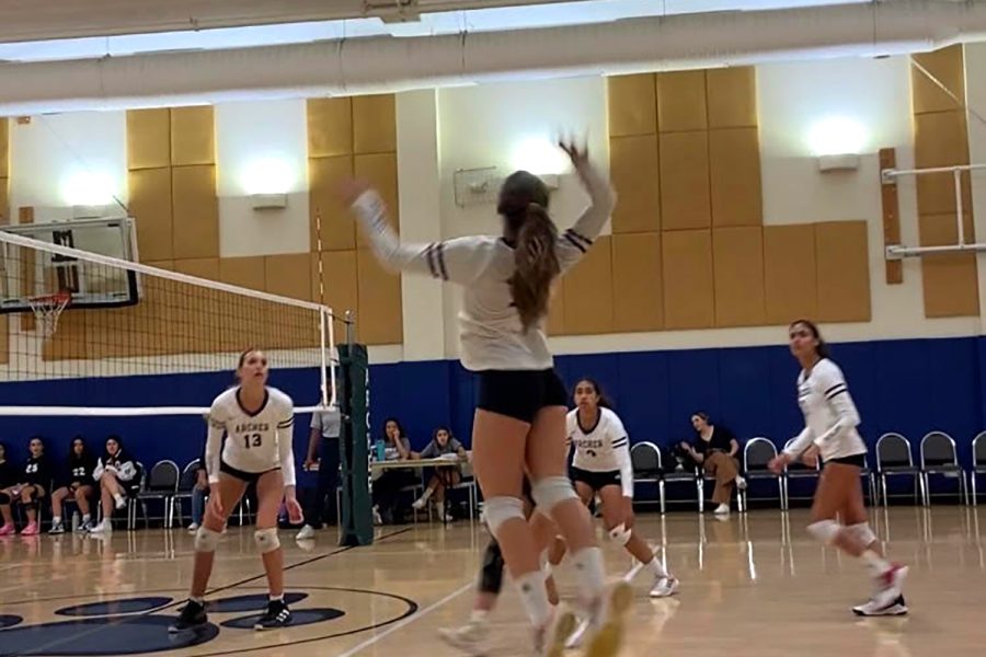 Sophomore Tavi Memoli jumps in preparation to hit the ball during a league game. The game took place at Park Century School Sept. 22 against Rose and Alex Pilibos Armenian School. The varsity volleyball team won the game 3-0.