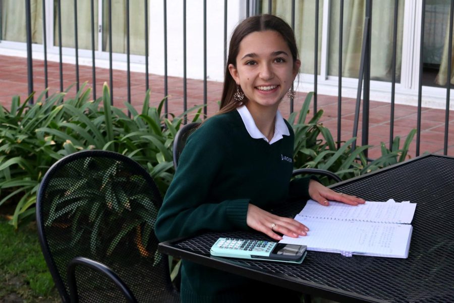 Sophomore+Julianna+Hatton+sits+down+in+the+Archer+courtyard+with+her+math+notebook+and+calculator+ready+to+work+on+math.+Hatton+specializes+in+math+and+began+tutoring+students+during+the+pandemic.