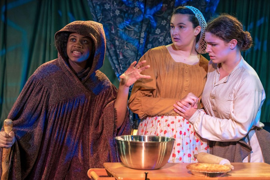 The witch reveals their spell to the Baker and his wife in a scene from the upper school musical, Into the Woods. Senior Grace Delossa played the Baker, Bryce Collis (’25) played the Baker’s wife and Anaiya Asomugha (’24) played the witch. The musical was performed in the Blackbox theater Nov. 11, 12 and 13.
