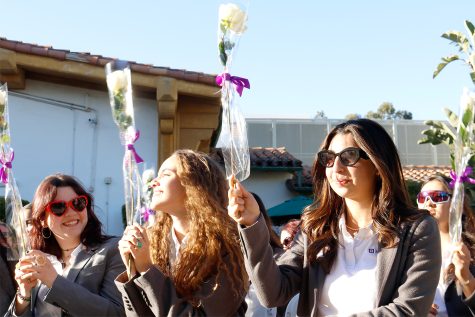 Sophia Altemus, Azel Al-Kadiri and Noor Afshar wave their white roses as the Unaccompained Minors, Archer’s upper school a cappella group, performs the school’s song “Within the Walls of Archer.” The annual Founder’s Day and the Senior Recognition Ceremony celebrated the women who established Archer and the women who will soon step into the world beyond Archer’s walls.