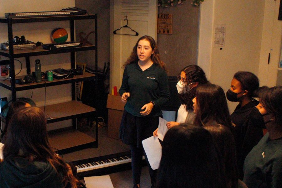 Piper Rutman leads the Unaccompanied Minors in a rehearsal before the winter concert preview. Rutman is the a cappella group manager and has arranged many songs for the group. I want my music to be spark emotions in a good way and be that sad or happy or whatever, Rutman said.