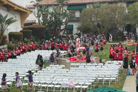 Seniors dance around the courtyard, decorated red for their class color, on Moving Up Day, June 3, 2022.