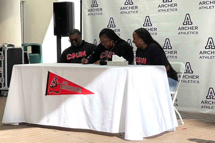 Senior Treasure Brown signs her National Letter of Intent to throw shot put at CSUN. Brown celebrated with her family and the Archer community Nov. 9.