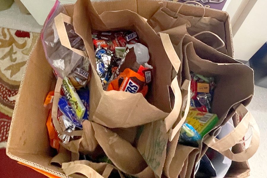 A cardboard box is filled to the brim with more than 40 pounds of candy for the Treats for Troops drive. The drive was hosted by The Artemis Center for Public Service and Social Good from Nov. 1 through Nov. 4.