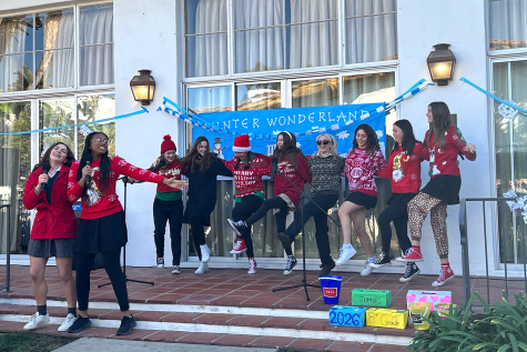 Junior Anaiya Asomugha and sophomore Bryce Collis sing Christmas Tree Farm by Taylor Swift and students dance with them. Winter Wonderland took place in the courtyard Friday, Dec. 9.