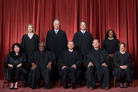Justices pose on June 30, 2022 after Justice Ketanji Brown Jackson joined the high Court. The justices nominated by conservatives have recently dealt with controversy involving corruption.