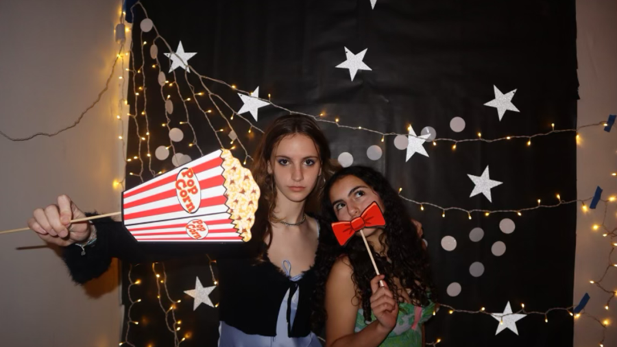 Olivia Boehm (’26) and Sara Salehi (’26) posed at the photo booth for the ninth and 10th grade social. The social also included a ping pong table, DJ, and friendship bracelets on Feb. 3.