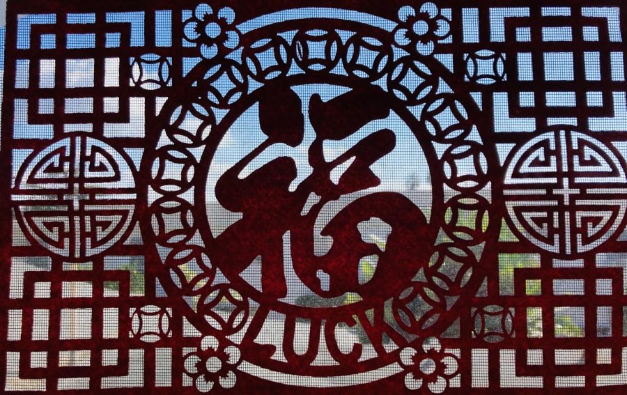Red felt is cut into elaborate patterns and characters and hung around the house or above doorframes. People who celebrate Lunar New Year hang the felt for good luck, which is shown through the character “fu” (福) because it can mean “good luck” or “prosperity.”