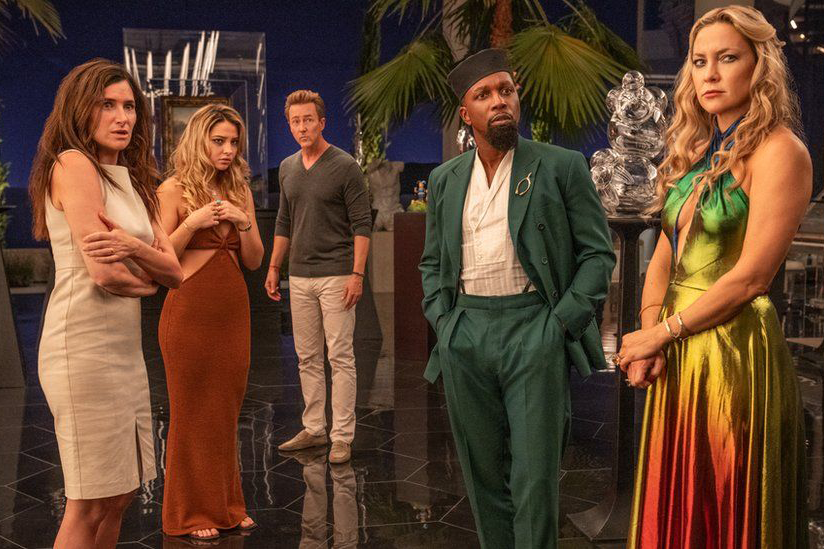 This promotional image features characters Claire Debella, Whiskey, Miles Bron, Lionel Toussaint and Birdie Jay who are all witnesses to a shocking revelation. Glass Onion: A Knives Out Mystery is comical murder-mystery featuring an ensemble cast of eccentric characters. This film premiered on Netflix Dec. 23 and is available for streaming.