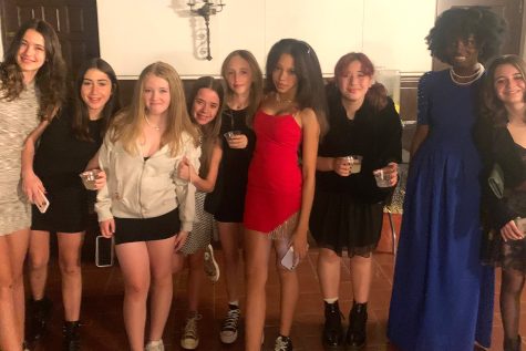 A group of seventh graders gather together for a picture in the dining hall during the seventh grade social Friday, Jan. 27. The social had an Old Hollywood theme, and students and dance committee members provided pizza, snacks and games for attending students.