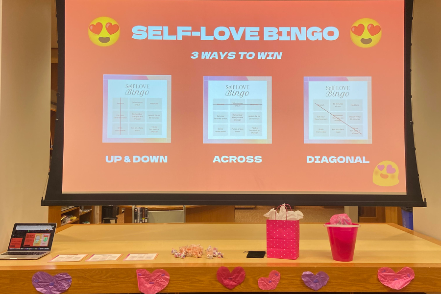 Decorations, goodie bags and instructions for the self-love bingo are presented in the Tia Palermo library. The librarians hosted a Valentine’s Day celebration after school Feb. 14.