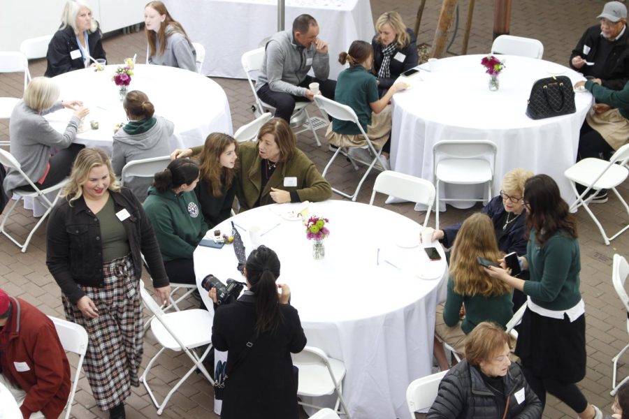 Students, grandparents and special friends mingle in the amphitheater courtyard for Archers annual Grandparents and Special Friends Day celebration. The event took place March 23 and 24 over the course of six brief sessions.