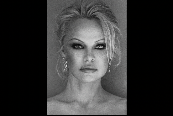 A picture of Pamela Anderson from Netflix for her documentary. The documentary is called Pamela A Love Story.