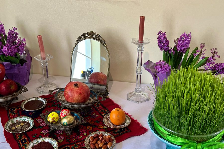 Fruits, grass, a mirror, cookies and sweet treats sit on Archer’s haft-seen table. A haft-seen table is created to celebrate Nowruz, the Persian New Year, and allowed for Archer students to engage with the culture. 