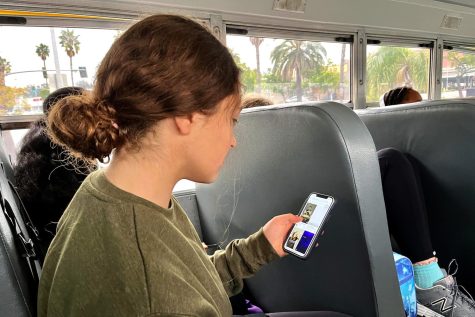 Freshman Caroline Collis sits on the bus in the morning while scrolling through TikTok videos under the hashtag of #mentalhealth. Sophomore Francie Wallack said TikTok is one of the main social media apps that perpetuates certain ways of talking about mental health.