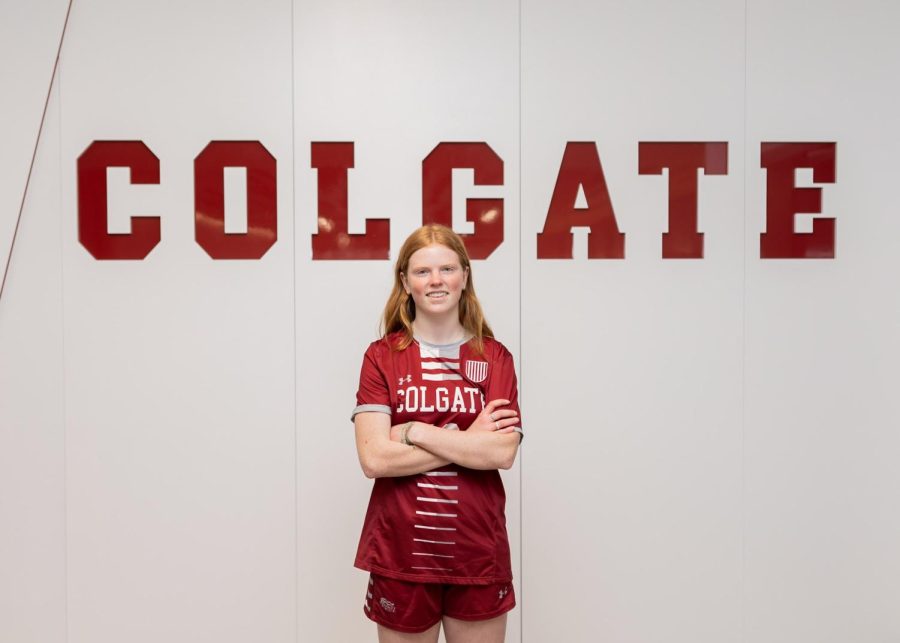Junior Cate Childers poses in a Colgate University soccer jersey to celebrate her commitment to their Division I women’s soccer team. From starting soccer at age 4 to joining the recruiting pool freshman year to committing to Colgate April 29, Childers said she is relieved and excited to see what the future holds. 