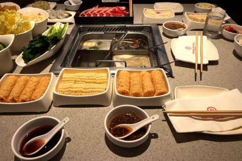This is the table set up at Haidilao Hot Pot that my extended family and I had when we went for dinner. We ordered many items, including egg noodles, spinach, corn, fried bean curd rolls and chicken fried rice. I highly recommend this restaurant for a unique dining experience that exposes you to a part of Chinese culture.