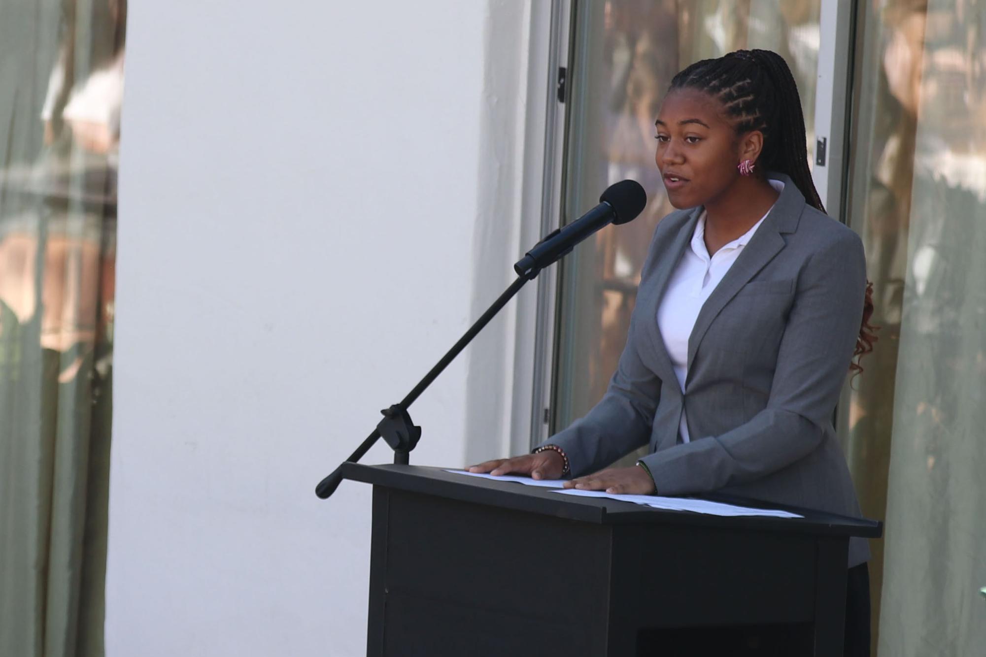 Student Body President Anaiya Asomugha (24) speaks to students and faculty, welcoming everyone to the 2023-24 school year Aug. 22. Asomugha and Head of School Elizabeth English gave speeches in the courtyard in celebration of the first day of school.