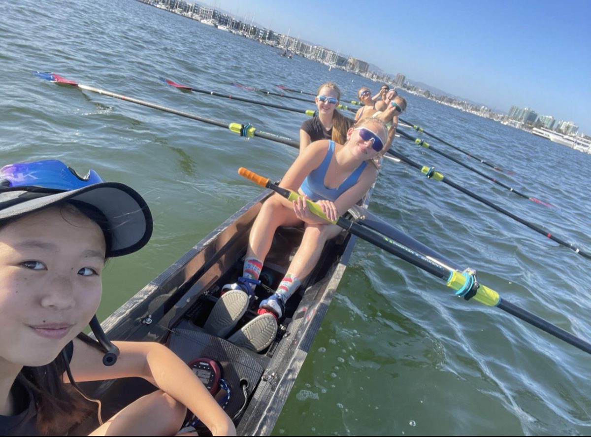 Senior Sophie Sackett and her rowing crew wait for their coaches boat to launch from the dock before practice.  Sackett practices Monday to Friday from 4:15-6:45 p.m. at Marina Aquatic Center in Marina Del Ray.