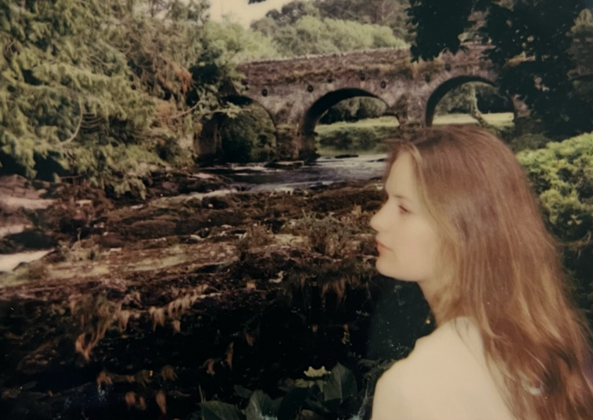 Eleanor Madley (’24) gazes out over River Sheen at the greenery in Sheen Falls, County Kerry, Ireland. Madley said she is considering using this photo, a Polaroid taken on vintage film, as the cover of her EP, “National Park, My Mind.” It’s very magical, and I really wanted to bring that in because ... I allude to the natural world a lot to express how I was feeling when I was younger and going through all that, Madley said. So, I really wanted to bring in that really whimsical, magical feeling. Photo by Jacob Madley. 