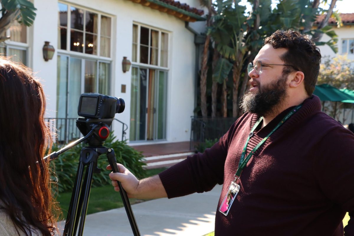 Film+teacher+Andrew+Ruiz+instructs+his+Advanced+Film+class+in+the+courtyard+and+teaches+about+cine+lenses.+Visual+Arts+Department+Chair+Marya+Alford+observed+one+of+his+classes%2C+watching+students+take+on+collaborative+positions+to+create+a+film.+It+was+really+fun+to+see+students+enter+different+roles+like+cinematographer+or+director+and+just+jump+into+those+roles+and+take+them+seriously+even+if+it+wasnt+their+first+choice%2C+Alford+said.+It+is+all+working+towards+the+final+result+of+the+film.